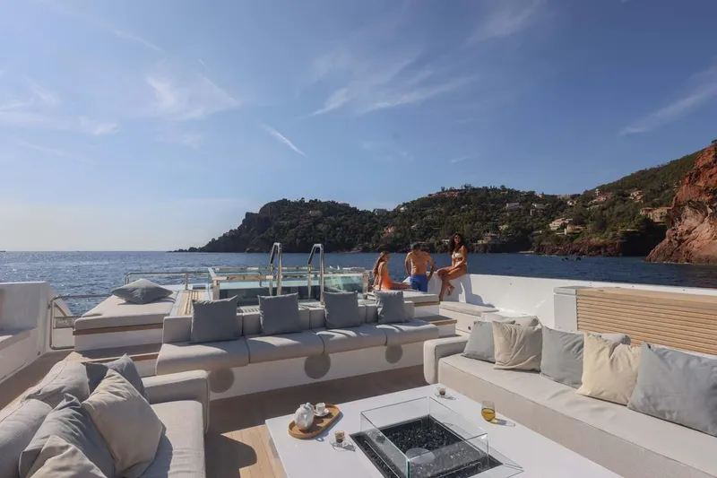 Slide: The Image of Luxurious 2023 Canados Expedition Yacht with spacious deck, scenic coastal view, and elegant seating. - 33