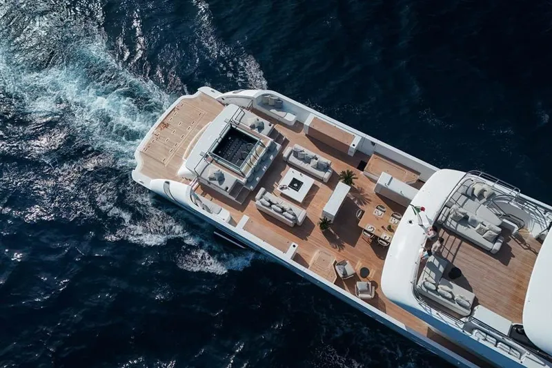 Slide: The Image of Luxurious 2023 Canados Expedition Yacht cruising on open sea, featuring spacious deck and elegant seating. - 43
