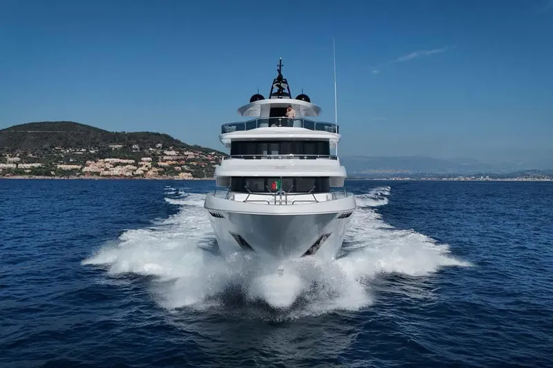 Slide: The Image of 2023 Canados Expedition Yacht cruising on open sea with scenic coastal backdrop. - 48