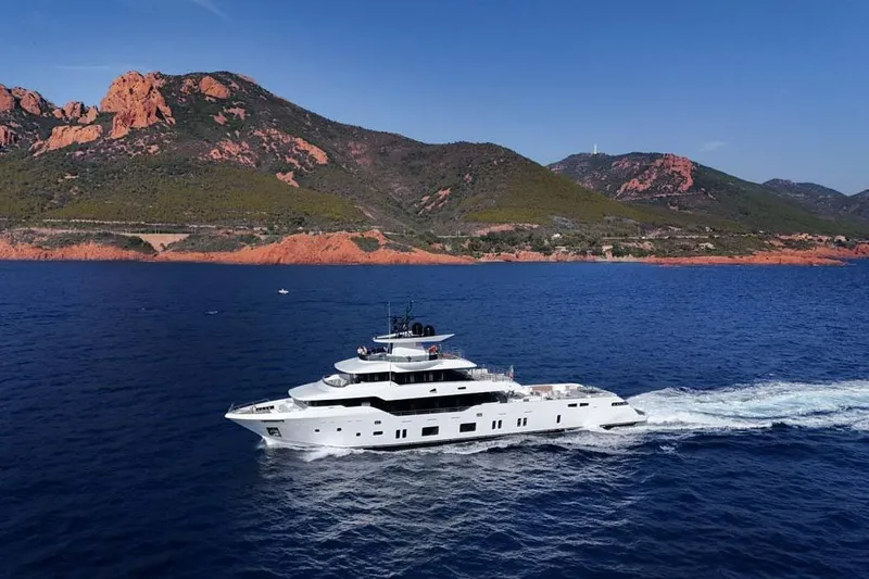 Slide: The Image of 2023 Canados Expedition Yacht cruising near scenic coastal mountains. - 50