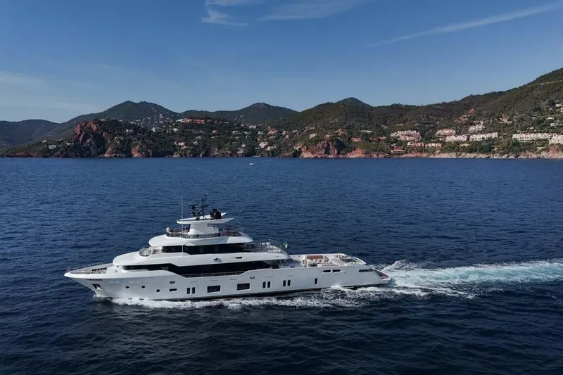 Slide: The Image of 2023 Canados Expedition Yacht cruising near scenic coastal landscape. - 51