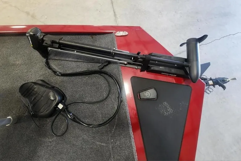 Slide: The Image of 2025 Tracker Pro 170 boat with trolling motor and foot pedal on red deck. - 4