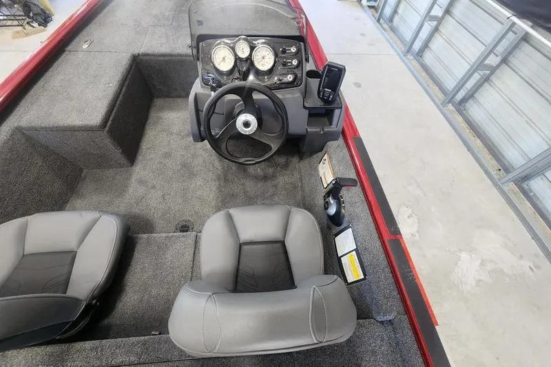Slide: The Image of 2025 Tracker Pro 170 boat interior with steering wheel and seating. - 6