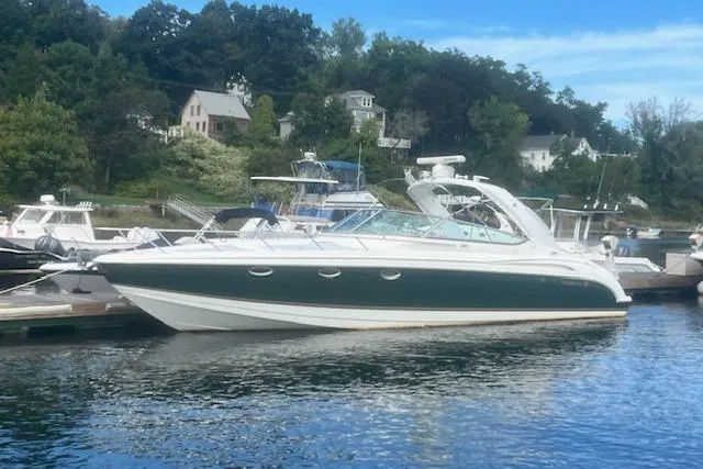 The Image of 2003 Formula 370 Super Sport boat docked in a scenic marina setting. - 0