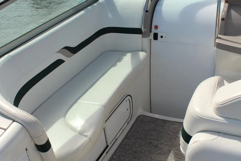 Slide: The Image of Interior seating of 2003 Formula 370 Super Sport boat, featuring white upholstery and sleek design. - 14
