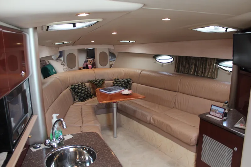 Slide: The Image of Luxurious interior of a 2003 Formula 370 Super Sport yacht with plush seating and modern amenities. - 15