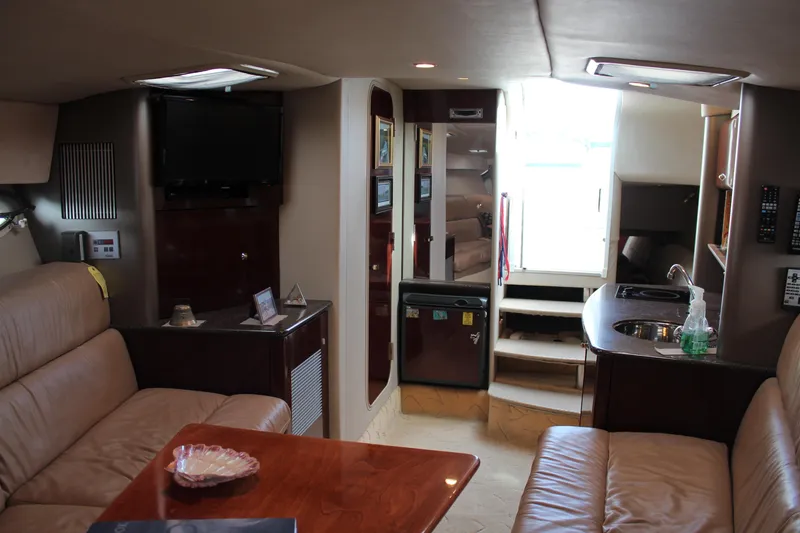 Slide: The Image of Interior of a 2003 Formula 370 Super Sport yacht with luxurious seating and kitchenette. - 16