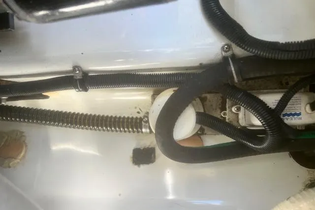 Slide: The Image of Engine compartment of a 2003 Formula 370 Super Sport boat, showing wiring and components. - 25