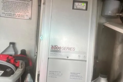 Slide: The Image of Electrical panel in a 2003 Formula 370 Super Sport boat engine room. - 26