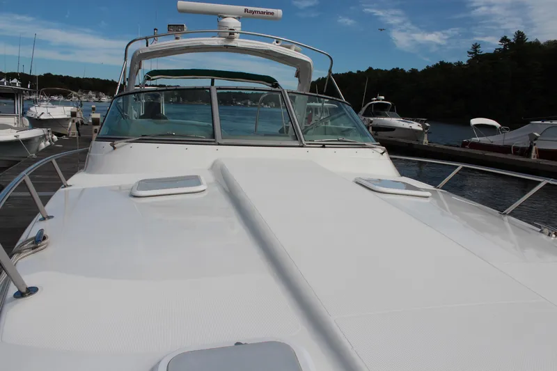 Slide: The Image of 2003 Formula 370 Super Sport boat docked at marina under clear sky. - 5