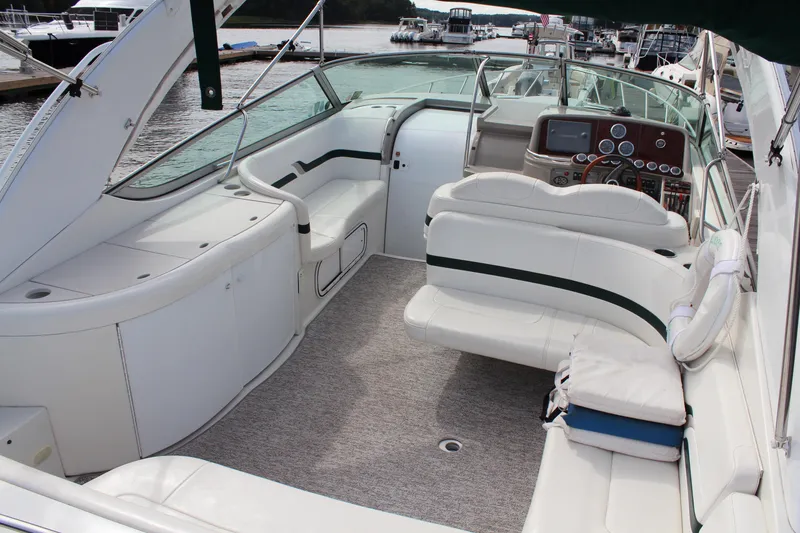 Slide: The Image of 2003 Formula 370 Super Sport boat interior with white seating and control panel. - 7