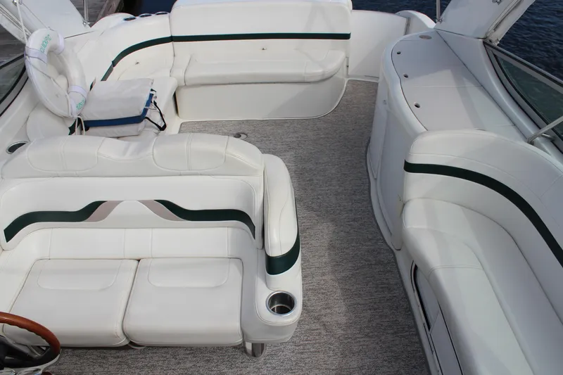 Slide: The Image of 2003 Formula 370 Super Sport boat interior with white seating and carpeted floor. - 9