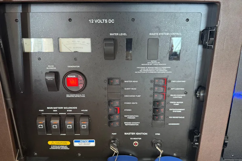 Slide: The Image of Control panel of a 2017 Sea Ray Sundancer 400 boat, featuring various switches and gauges. - 16