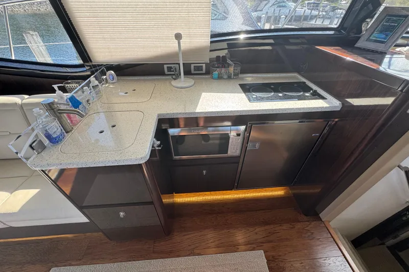 Slide: The Image of Luxurious 2017 Sea Ray Sundancer 400 yacht kitchen with modern appliances and sleek design. - 20