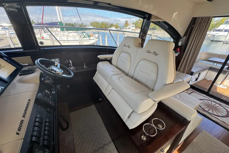 Slide: The Image of Luxurious 2017 Sea Ray Sundancer 400 yacht interior with plush seating and modern helm. - 22