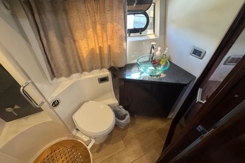 Slide: The Image of Luxurious bathroom in 2017 Sea Ray Sundancer 400 yacht with modern fixtures and elegant design. - 25