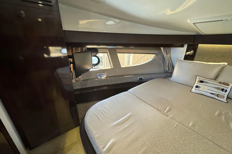 Slide: The Image of Luxurious cabin interior of 2017 Sea Ray Sundancer 400 yacht with elegant bedding and window view. - 28