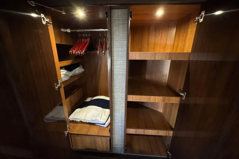 Slide: The Image of Luxurious wooden closet interior on 2017 Sea Ray Sundancer 400 yacht. - 29
