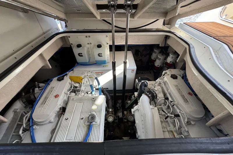 Slide: The Image of Engine compartment of 2017 Sea Ray Sundancer 400 yacht, showcasing dual engines and mechanical components. - 35