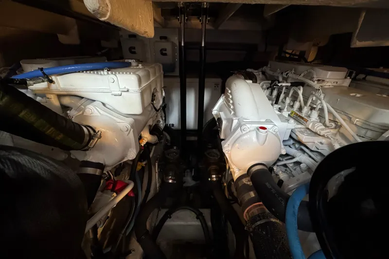 Slide: The Image of Engine room of 2017 Sea Ray Sundancer 400 with dual engines and mechanical components. - 36