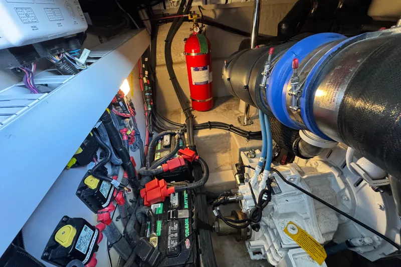 Slide: The Image of Engine room of 2017 Sea Ray Sundancer 400 with batteries and fire extinguisher. - 38