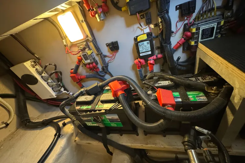 Slide: The Image of Engine room of 2017 Sea Ray Sundancer 400 with batteries and wiring. - 39