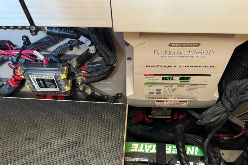 Slide: The Image of Battery charger and wiring in 2017 Sea Ray Sundancer 400 boat engine compartment. - 42
