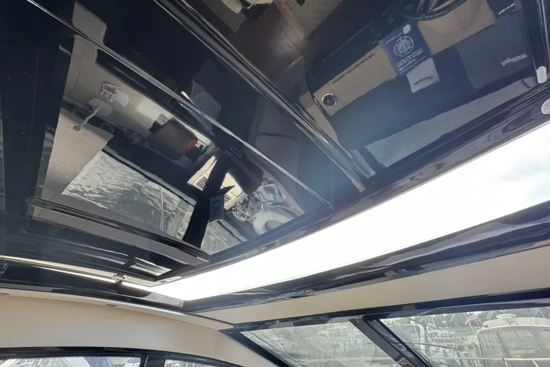 Slide: The Image of Interior view of 2017 Sea Ray Sundancer 400 yacht with sleek black ceiling design. - 44