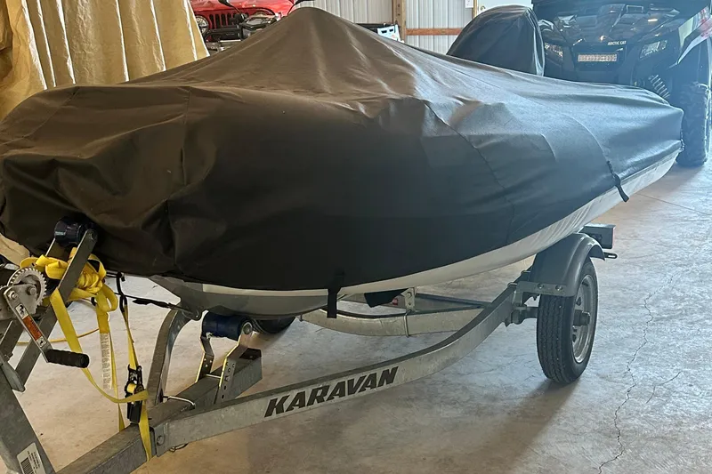 Slide: The Image of Covered Sea Ray Sundancer 400 boat on Karavan trailer, stored indoors. - 48