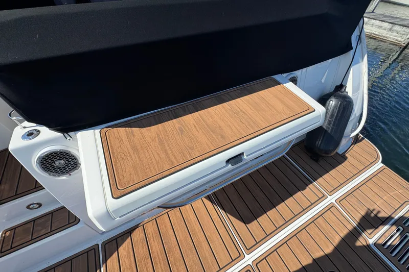 Slide: The Image of 2017 Sea Ray Sundancer 400 swim platform with teak decking and black fender. - 7