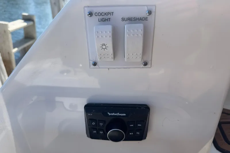 Slide: The Image of Control panel on a 2017 Sea Ray Sundancer 400 yacht with cockpit light and sureshade switches. - 9