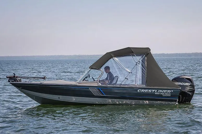 Slide: The Image of 2018 Crestliner 1750 Fish Hawk SC boat interior with seat and fishing equipment. - 2