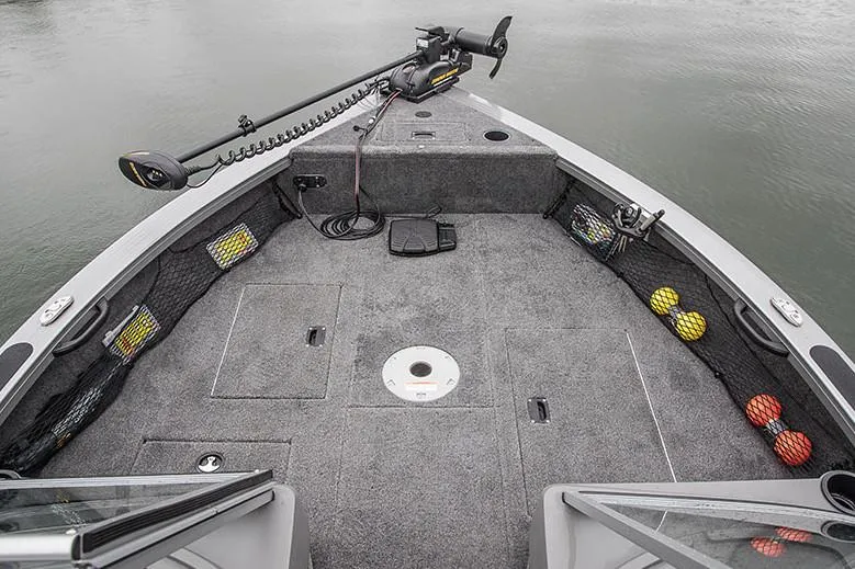 Slide: The Image of 2018 Crestliner 1750 Fish Hawk SC boat with dual seats and windshield, docked outdoors. - 3