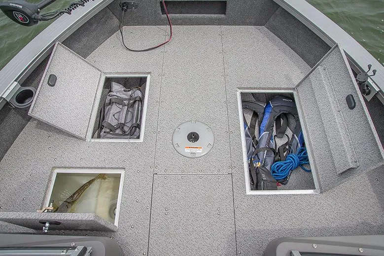 Slide: The Image of 2018 Crestliner 1750 Fish Hawk SC boat interior with motor and fishing equipment. - 4