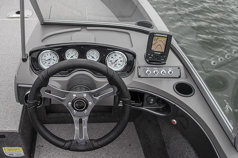 Slide: The Image of 2018 Crestliner 1750 Fish Hawk SC boat dashboard with steering wheel and navigation equipment. - 6