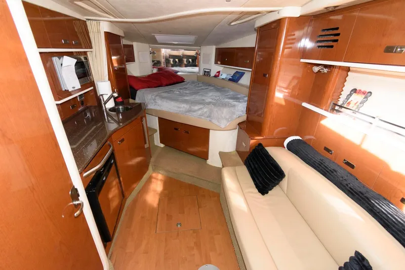 Slide: The Image of Interior of 2012 Sea Ray 330 Sundancer yacht with cozy cabin and modern amenities. - 16
