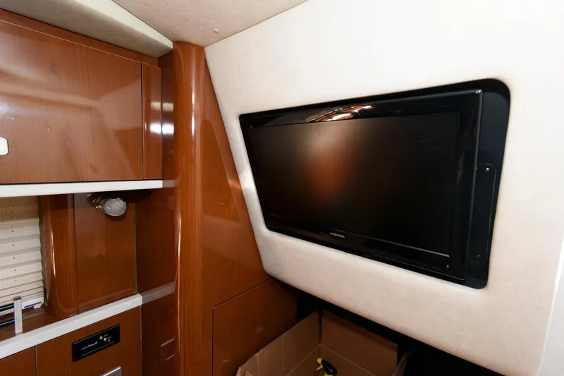 Slide: The Image of Interior of 2012 Sea Ray 330 Sundancer with mounted flat-screen TV. - 23