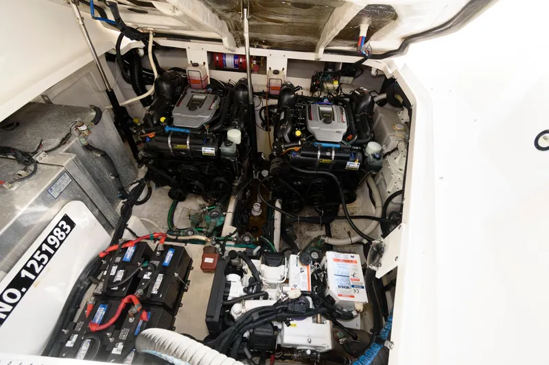 Slide: The Image of Engine room of 2012 Sea Ray 330 Sundancer with dual engines and batteries. - 24