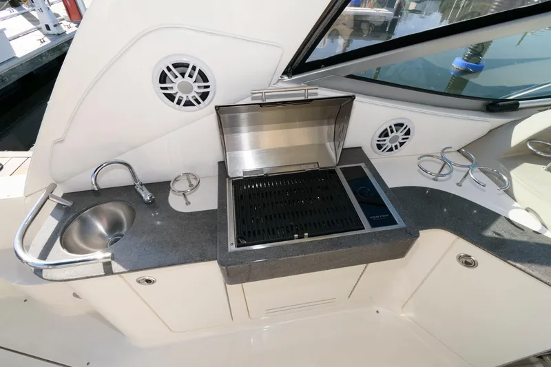 Slide: The Image of Outdoor kitchen on 2012 Sea Ray 330 Sundancer yacht with grill and sink. - 9