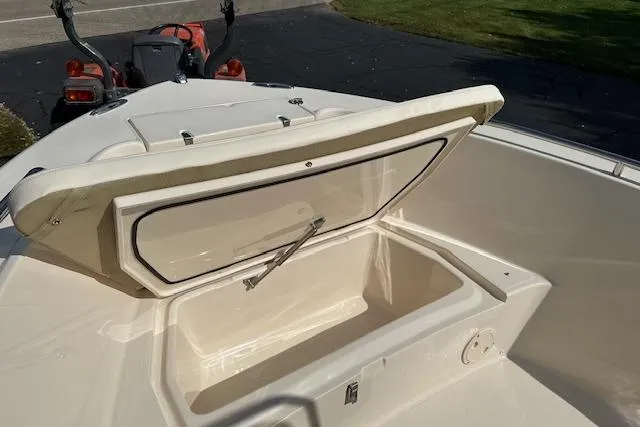 Slide: The Image of 2026 Grady-White Fisherman 180 boat storage compartment open, showcasing spacious interior. - 16