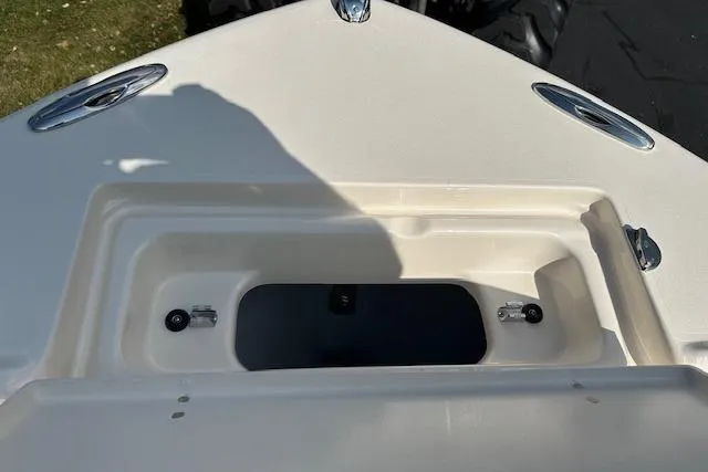 Slide: The Image of 2026 Grady-White Fisherman 180 boat deck with storage compartment, featuring sleek design elements. - 17