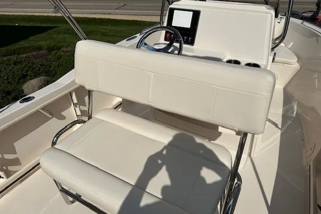 Slide: The Image of 2026 Grady-White Fisherman 180 boat interior with white seating and steering console. - 23