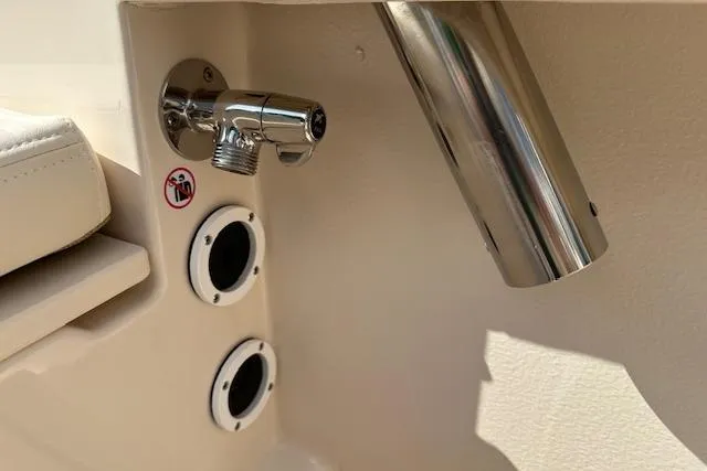 Slide: The Image of 2026 Grady-White Fisherman 180 boat detail with stainless steel fittings and warning sticker. - 25