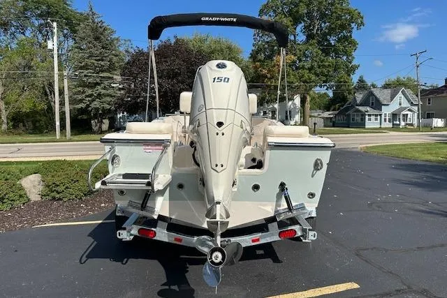 Slide: The Image of 2026 Grady-White Fisherman 180 boat with 150 HP engine, parked on a trailer. - 3
