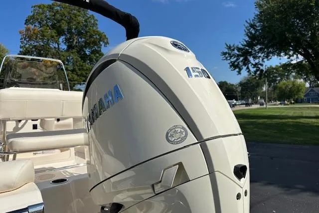 Slide: The Image of 2026 Grady-White Fisherman 180 with Yamaha 150 engine, parked outdoors. - 4