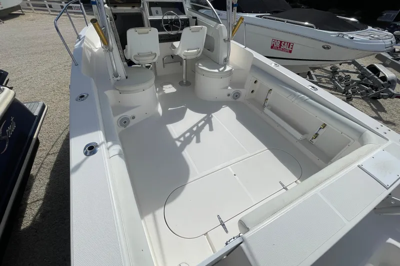 Slide: The Image of 1997 Wellcraft 240 Coastal boat interior with seating and steering wheel, for sale. - 16
