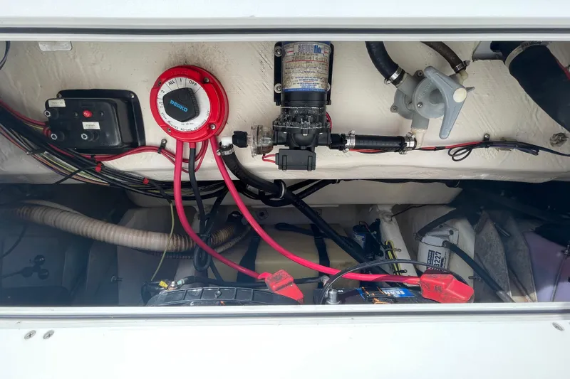 Slide: The Image of Electrical and mechanical components inside a 1997 Wellcraft 240 Coastal boat. - 17