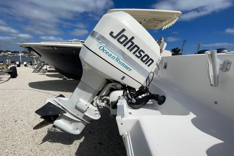 Slide: The Image of 1997 Wellcraft 240 Coastal boat with Johnson Ocean Runner outboard motor. - 3