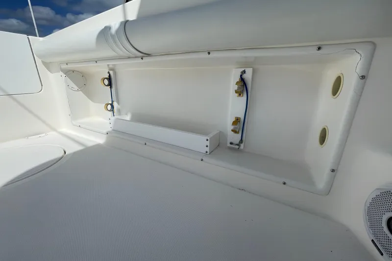 Slide: The Image of Interior view of a 1997 Wellcraft 240 Coastal boat, showcasing storage compartments. - 8