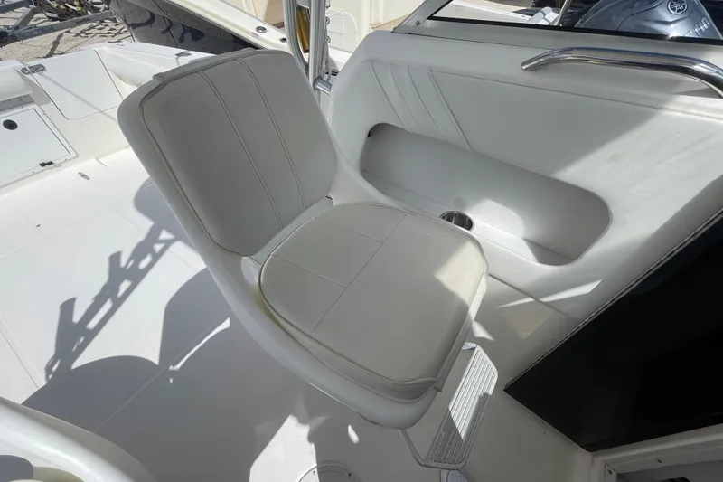 Slide: The Image of White seat on 1997 Wellcraft 240 Coastal boat, featuring sleek interior design. - 9